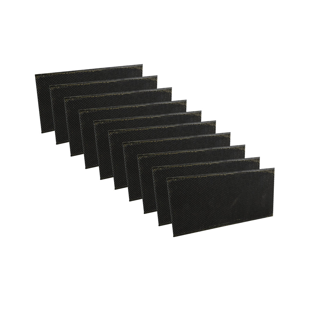 A collection of black plastic bee foundations arranged side by side.